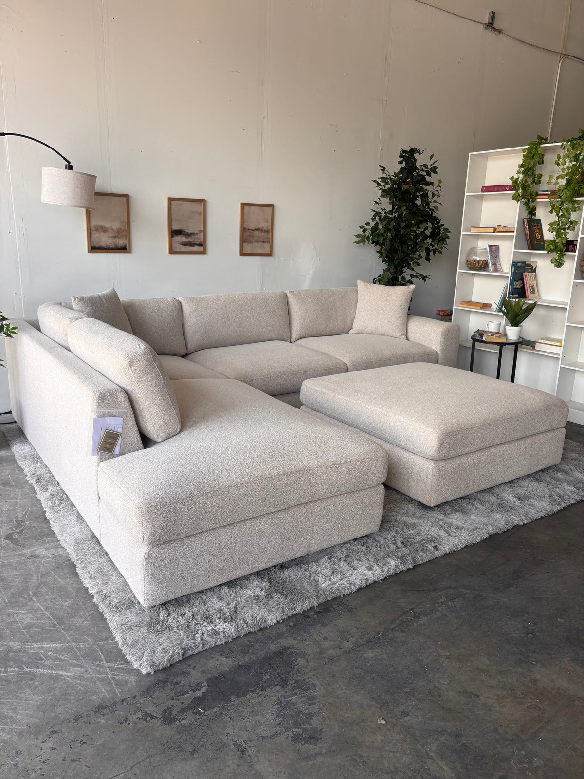 A cream sectional at the Couch Guys warehouse